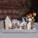 LED vánoční vesnička, 34x17cm, dřevo, 4 LED, 2x AA